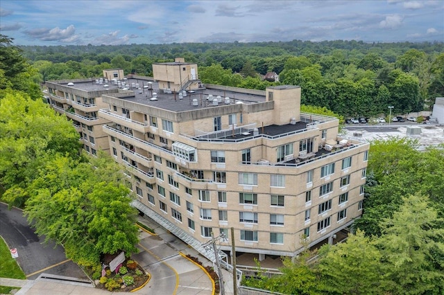 1270 N Ave Unit 5A, New Rochelle, NY 10804 - view of building exterior with a wooded view