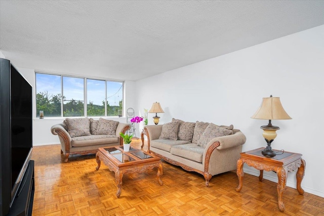 1270 N Ave Unit 5A, New Rochelle, NY 10804 - living room featuring a textured ceiling and baseboards
