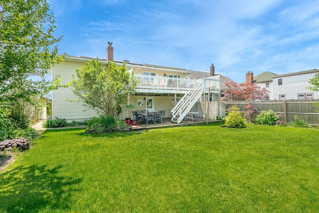 255 Rose St, Copiague, NY 11726 - rear view of property featuring a patio area, a wooden deck, and stairway