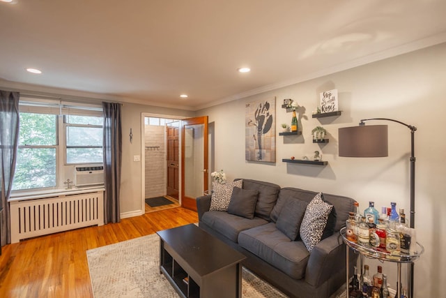 192-1239th Ave 1, Flushing, NY 11358 - living area with radiator heating unit, crown molding, wood finished floors, recessed lighting, and cooling unit