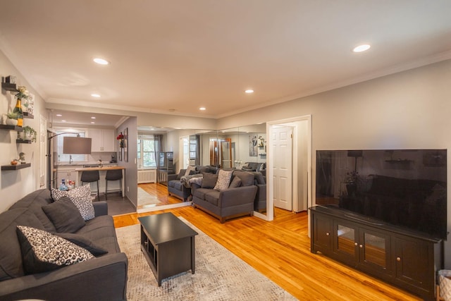 192-1239th Ave 1, Flushing, NY 11358 - living area featuring light wood-type flooring, ornamental molding, radiator, and recessed lighting