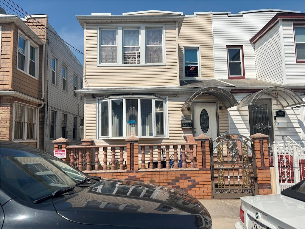 104-16 103rd St, Richmond Hill, NY 11419 - view of front of property featuring a gate