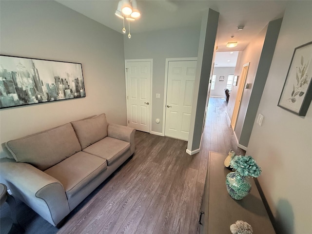 310 Narragansett Villas Dr, Lindenhurst, NY 11757 - living area featuring dark wood finished floors and a ceiling fan