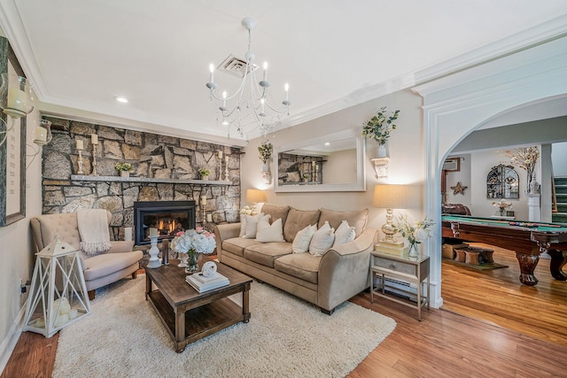 6 Pine St N, Lake Grove, NY 11755 - living room featuring ornamental molding, pool table, wood finished floors, a stone fireplace, and recessed lighting