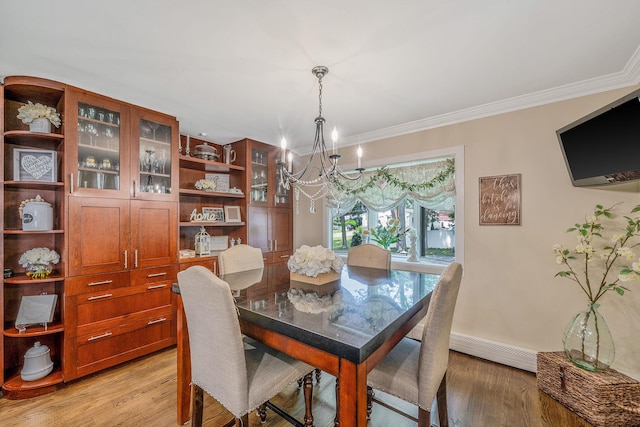 6 Pine St N, Lake Grove, NY 11755 - dining area featuring a chandelier, light wood-style floors, a baseboard radiator, and ornamental molding
