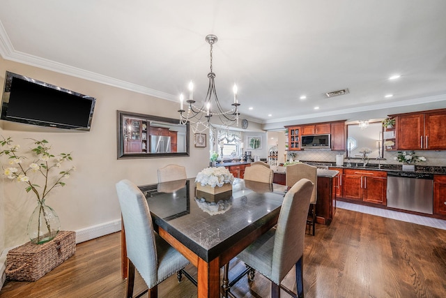 6 Pine St N, Lake Grove, NY 11755 - dining area featuring a chandelier, baseboard heating, dark wood-style floors, ornamental molding, and recessed lighting