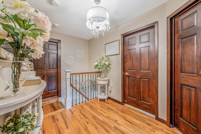 6 Pine St N, Lake Grove, NY 11755 - entryway featuring light wood-style floors and a chandelier