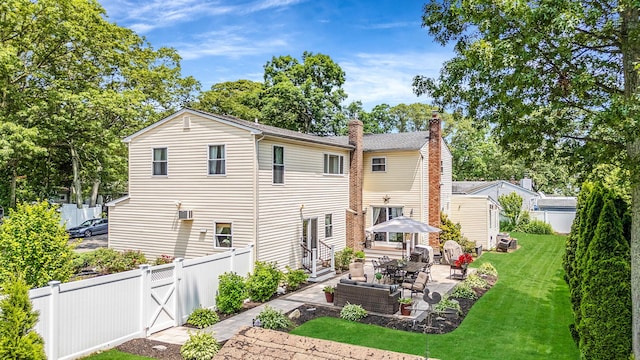 6 Pine St N, Lake Grove, NY 11755 - back of property with a patio, a fenced backyard, and a chimney