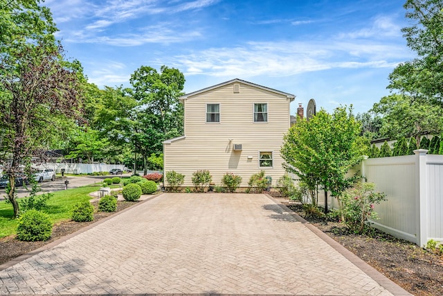 6 Pine St N, Lake Grove, NY 11755 - view of side of property featuring decorative driveway