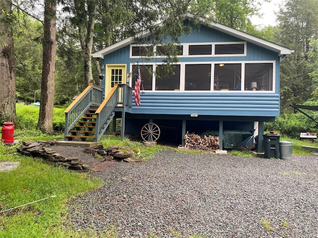 47 E Catskill Trl, Smallwood, NY 12778 - view of front facade featuring stairs and a sunroom