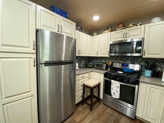 47 E Catskill Trl, Smallwood, NY 12778 - kitchen with stainless steel appliances, tasteful backsplash, dark wood-style floors, and light countertops