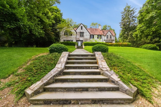 50 Overlook Dr, Chappaqua, NY 10514 - view of front of home featuring a chimney, a front yard, and stone siding
