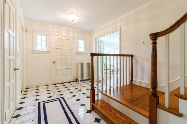 50 Overlook Dr, Chappaqua, NY 10514 - foyer entrance with radiator heating unit, healthy amount of natural light, and stairs