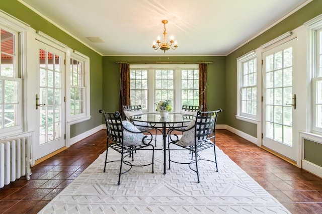 50 Overlook Dr, Chappaqua, NY 10514 - dining space with radiator heating unit, a chandelier, ornamental molding, and tile patterned flooring