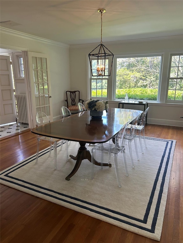 50 Overlook Dr, Chappaqua, NY 10514 - dining space featuring radiator, a chandelier, ornamental molding, and wood finished floors