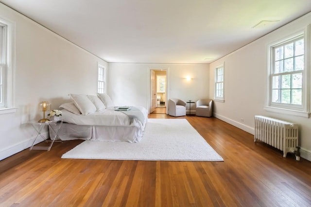50 Overlook Dr, Chappaqua, NY 10514 - bedroom with radiator, multiple windows, and wood finished floors