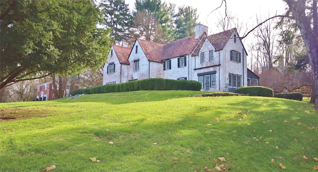 50 Overlook Dr, Chappaqua, NY 10514 - tudor home with a chimney and a front lawn