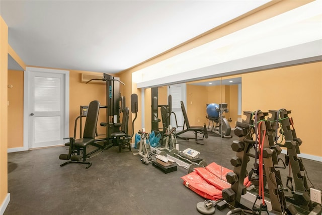 50 Overlook Dr, Chappaqua, NY 10514 - gym featuring baseboards and a wall mounted air conditioner