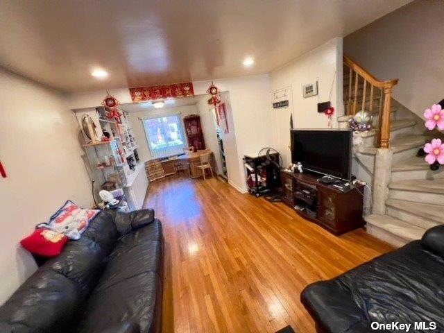 220-34 67th Ave Duplex, Unit Duplex, Bayside, NY 11364 - living area featuring wood finished floors, stairs, and recessed lighting