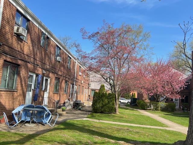 220-34 67th Ave Duplex, Unit Duplex, Bayside, NY 11364 - view of community featuring a yard