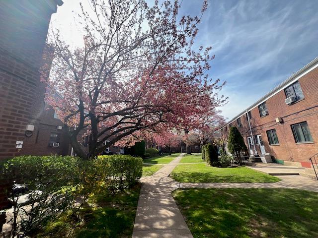 220-34 67th Ave Duplex, Unit Duplex, Bayside, NY 11364 - view of home's community with a yard