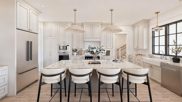 14 Akindale Rd, Pawling, NY 12564 - kitchen featuring built in appliances, tasteful backsplash, a kitchen island, a kitchen breakfast bar, and recessed lighting