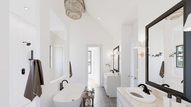 14 Akindale Rd, Pawling, NY 12564 - bathroom with a freestanding tub, two vanities, tile patterned floors, and vaulted ceiling
