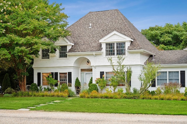 545 Hampton Rd Unit 16, Southampton, NY 11968 - view of front facade featuring a front yard and a shingled roof