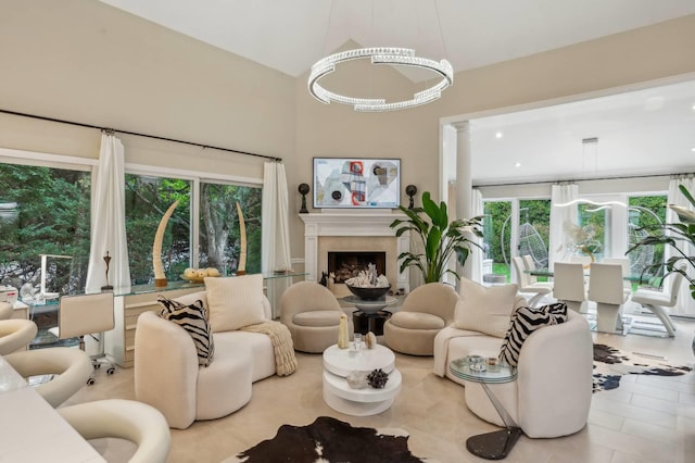 545 Hampton Rd Unit 16, Southampton, NY 11968 - living area featuring a fireplace, decorative columns, and tile patterned floors