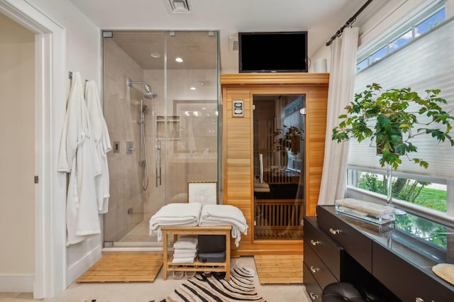 545 Hampton Rd Unit 16, Southampton, NY 11968 - full bathroom featuring a stall shower and healthy amount of natural light