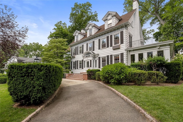 121 Overlook Cir, New Rochelle, NY 10804 - view of front of property featuring a balcony, a chimney, and a front yard