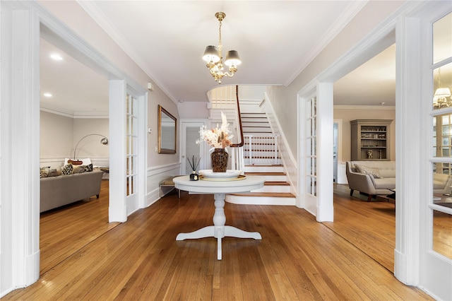 121 Overlook Cir, New Rochelle, NY 10804 - entryway with stairway, french doors, hardwood / wood-style floors, a chandelier, and ornamental molding