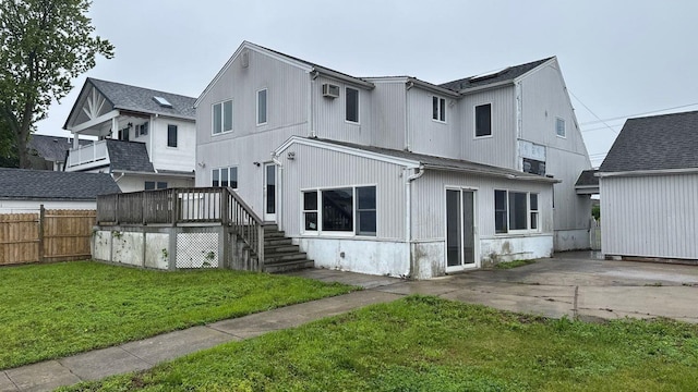 127 Forest Ave, Massapequa, NY 11758 - rear view of house featuring a deck and a patio area
