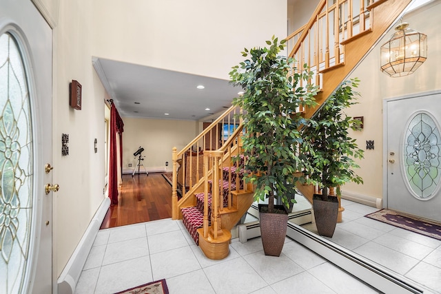427 Benito St, East Meadow, NY 11554 - foyer entrance with tile patterned floors, stairway, recessed lighting, and a high ceiling