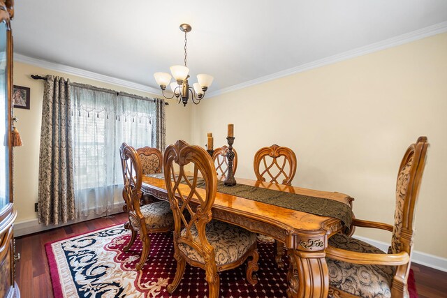 427 Benito St, East Meadow, NY 11554 - dining area featuring a chandelier, crown molding, and wood finished floors