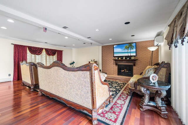 427 Benito St, East Meadow, NY 11554 - living room with a brick fireplace, wood finished floors, crown molding, a wall unit AC, and brick wall