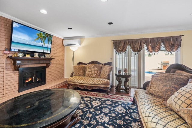 427 Benito St, East Meadow, NY 11554 - living area with an AC wall unit, crown molding, a brick fireplace, wood finished floors, and recessed lighting