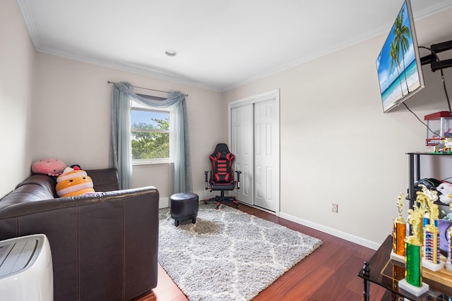 427 Benito St, East Meadow, NY 11554 - bedroom with dark wood finished floors, ornamental molding, and a closet