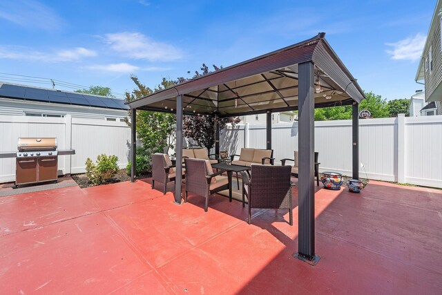 427 Benito St, East Meadow, NY 11554 - fenced backyard featuring grilling area, an outdoor living space, a gazebo, and a patio
