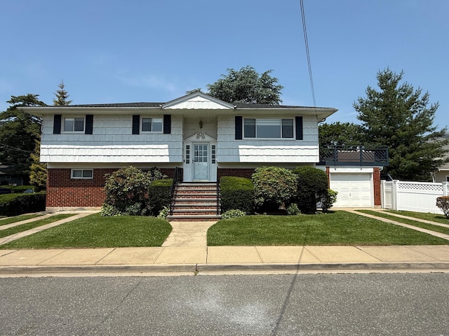 226LAURIELANE Laurie Ln, West Hempstead, NY 11552 - raised ranch featuring driveway, brick siding, and a garage
