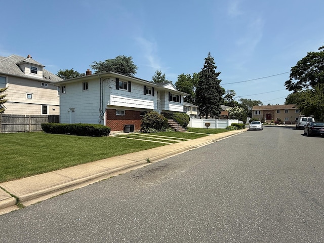 226LAURIELANE Laurie Ln, West Hempstead, NY 11552 - view of front facade featuring a chimney and brick siding