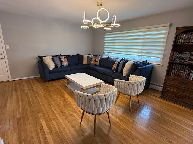 226LAURIELANE Laurie Ln, West Hempstead, NY 11552 - living area featuring a baseboard radiator, a chandelier, and wood finished floors