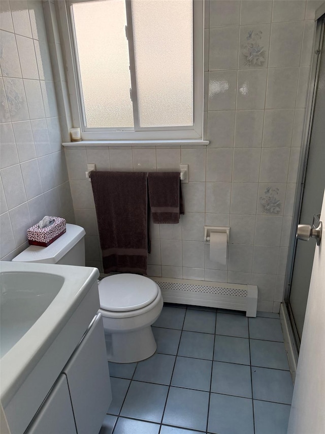 226LAURIELANE Laurie Ln, West Hempstead, NY 11552 - bathroom with tile walls, a shower stall, vanity, baseboard heating, and tile patterned flooring
