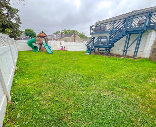 226LAURIELANE Laurie Ln, West Hempstead, NY 11552 - fenced backyard featuring a playground and stairs