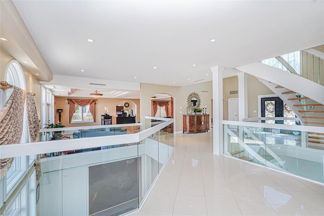 30 Aviva Ct, Staten Island, NY 10307 - bar area featuring light tile patterned floors, recessed lighting, arched walkways, and stairway