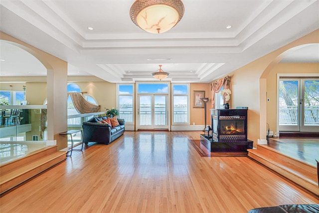 30 Aviva Ct, Staten Island, NY 10307 - living room with a raised ceiling, healthy amount of natural light, arched walkways, and wood finished floors