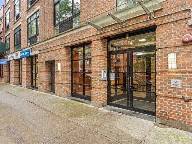 14 Hope St Unit 3F, Brooklyn, NY 11211 - view of exterior entry with brick siding and french doors