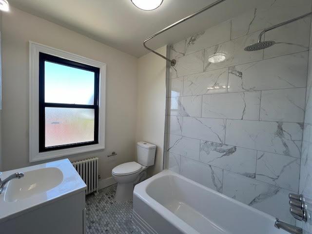 4118 Hill Ave, Bronx, NY 10466 - full bath featuring radiator heating unit, vanity, bathtub / shower combination, and tile patterned flooring
