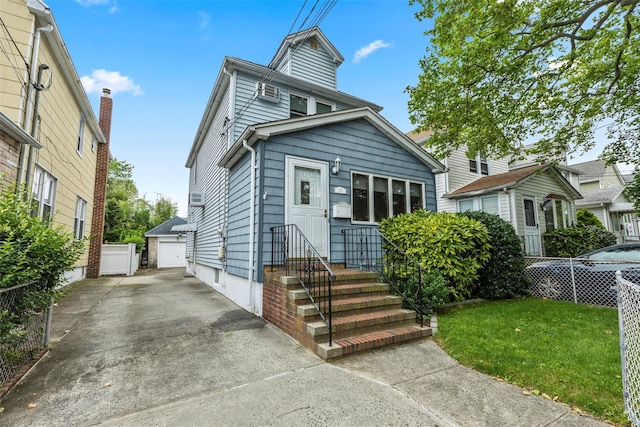 72 Putnam Ave, Valley Stream, NY 11580 - view of front of home with an outbuilding, a garage, and a front yard