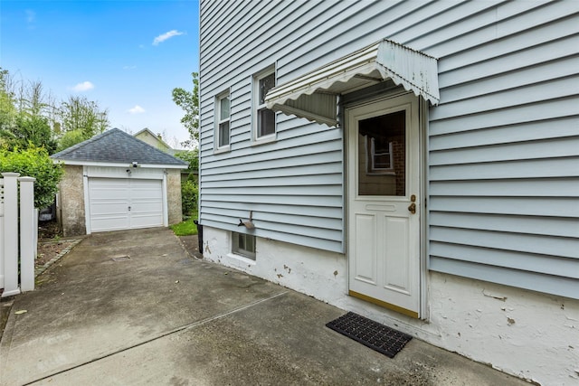 72 Putnam Ave, Valley Stream, NY 11580 - doorway to property featuring a garage and concrete driveway